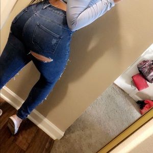 High waist distressed jeans in front and back